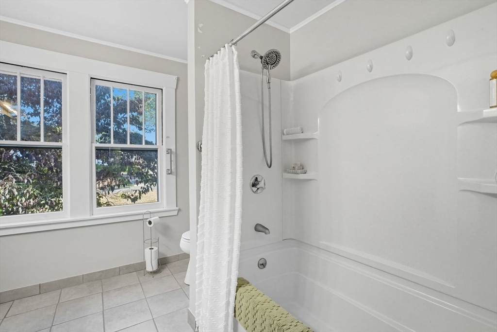 15 Bronson Terrace Springfield, MA 01108 - Photo 28 of 42 a bathroom with a bathtub a toilet and a shower