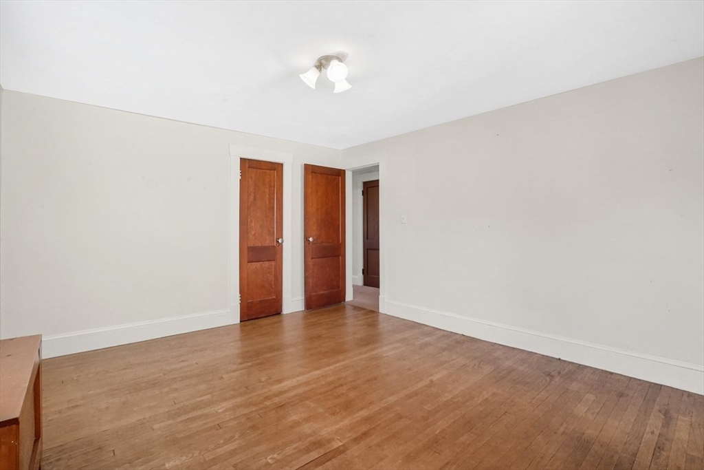 15 Bronson Terrace Springfield, MA 01108 - Photo 30 of 42 a view of an empty room with wooden floor