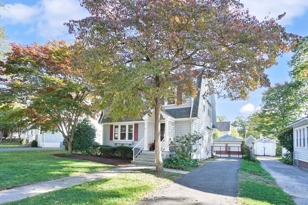 15 Bronson Terrace Springfield, MA 01108 - Photo 41 of 42 a front view of a house with a garden and tree