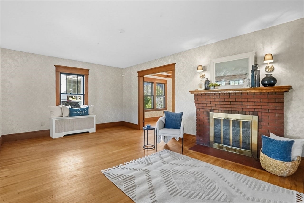 15 Bronson Terrace Springfield, MA 01108 - Photo 6 of 42 a living room with furniture and a fireplace