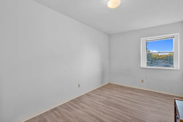 a bedroom with a bed and lamp