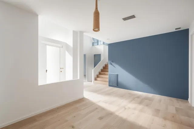 a view of an entryway with wooden floor