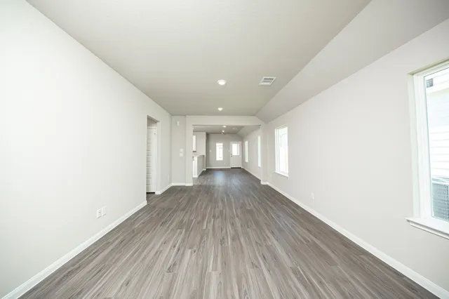 a view of gallery with wooden floor