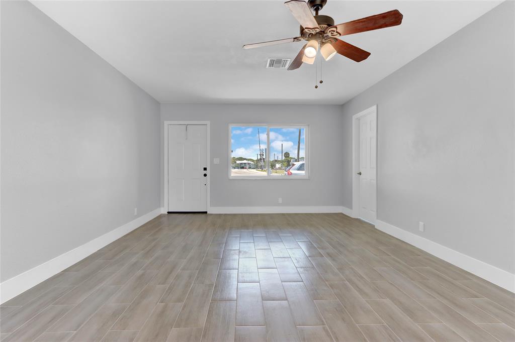 2822 North Dixie Highway Boca Raton, FL 33431 - Photo 16 of 22 wooden floor in an empty room with a window