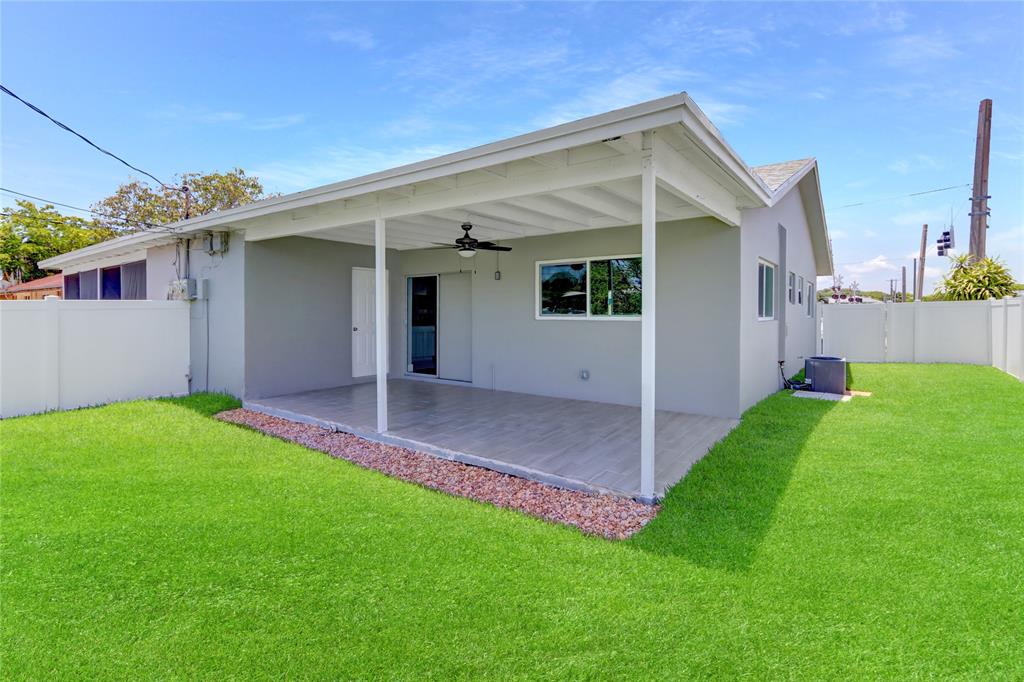 2822 North Dixie Highway Boca Raton, FL 33431 - Photo 2 of 22 front view of house with a yard