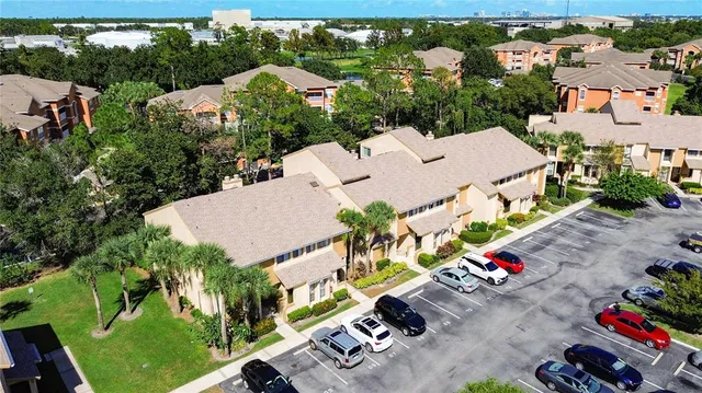 an aerial view of a house with sitting area