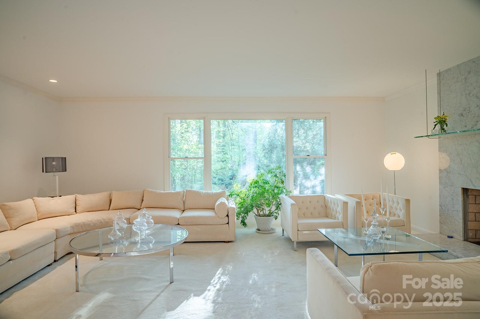 290 Tranquility Place Hendersonville, NC 28739 - Photo 12 of 48 a living room with furniture and a large window