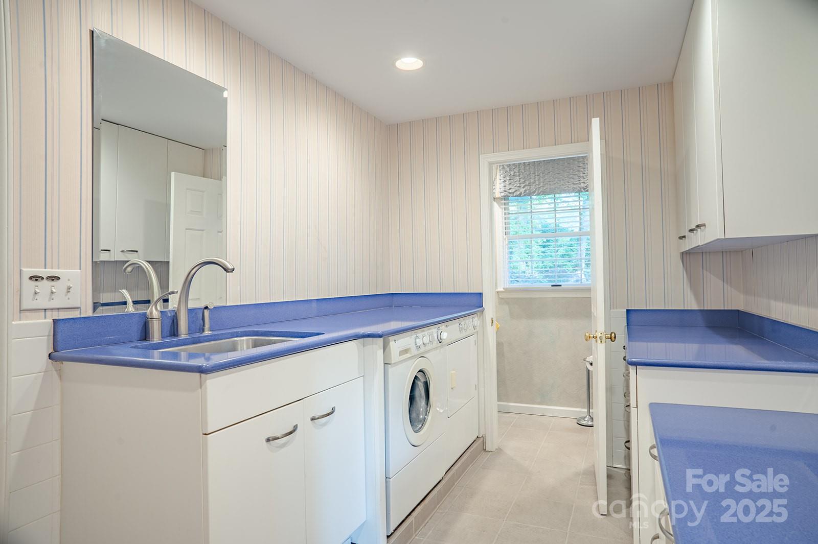 290 Tranquility Place Hendersonville, NC 28739 - Photo 20 of 48 a view of a sink with cabinets