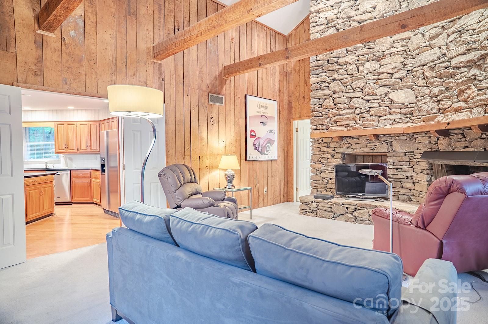 290 Tranquility Place Hendersonville, NC 28739 - Photo 23 of 48 a living room with furniture and a fireplace