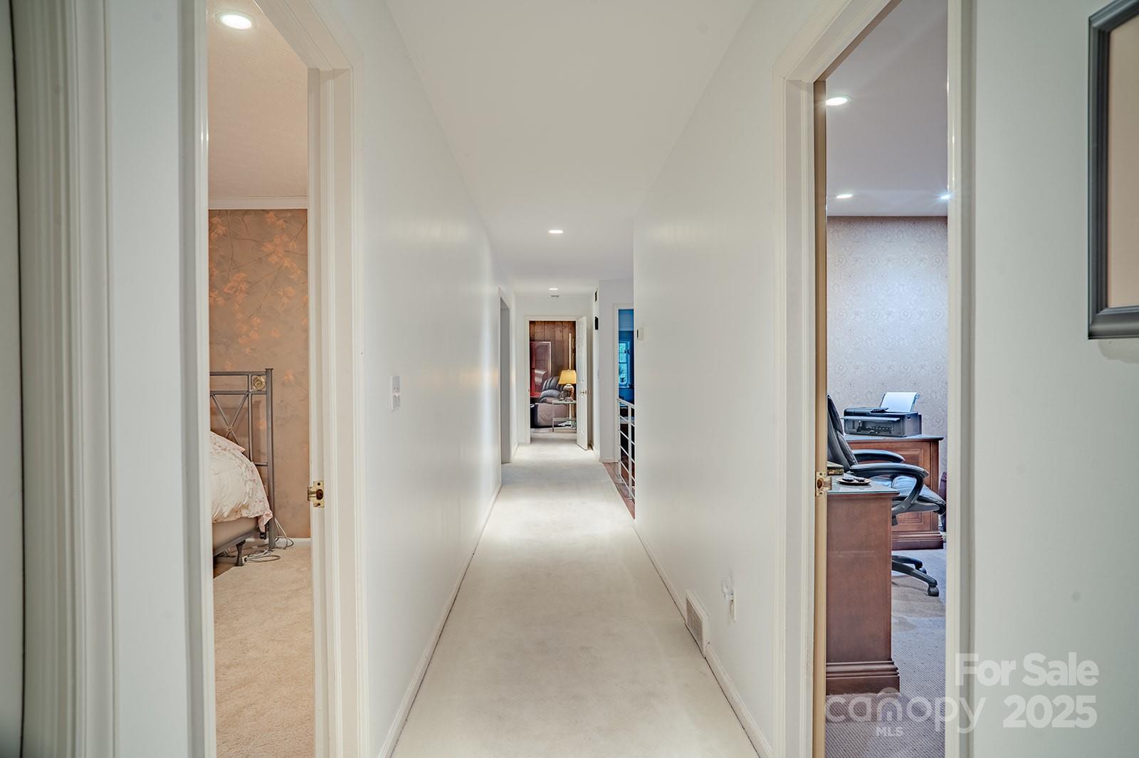 290 Tranquility Place Hendersonville, NC 28739 - Photo 27 of 48 a view of a hallway with closet and a living room