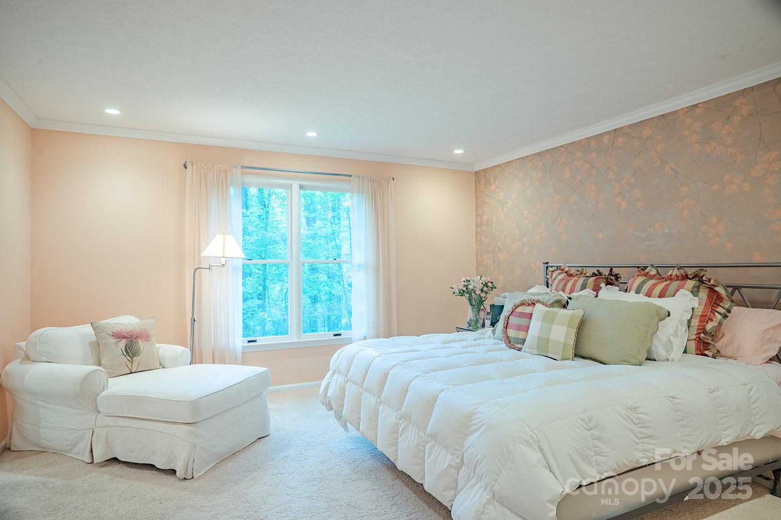 290 Tranquility Place Hendersonville, NC 28739 - Photo 28 of 48 a spacious bedroom with a bed and a couch