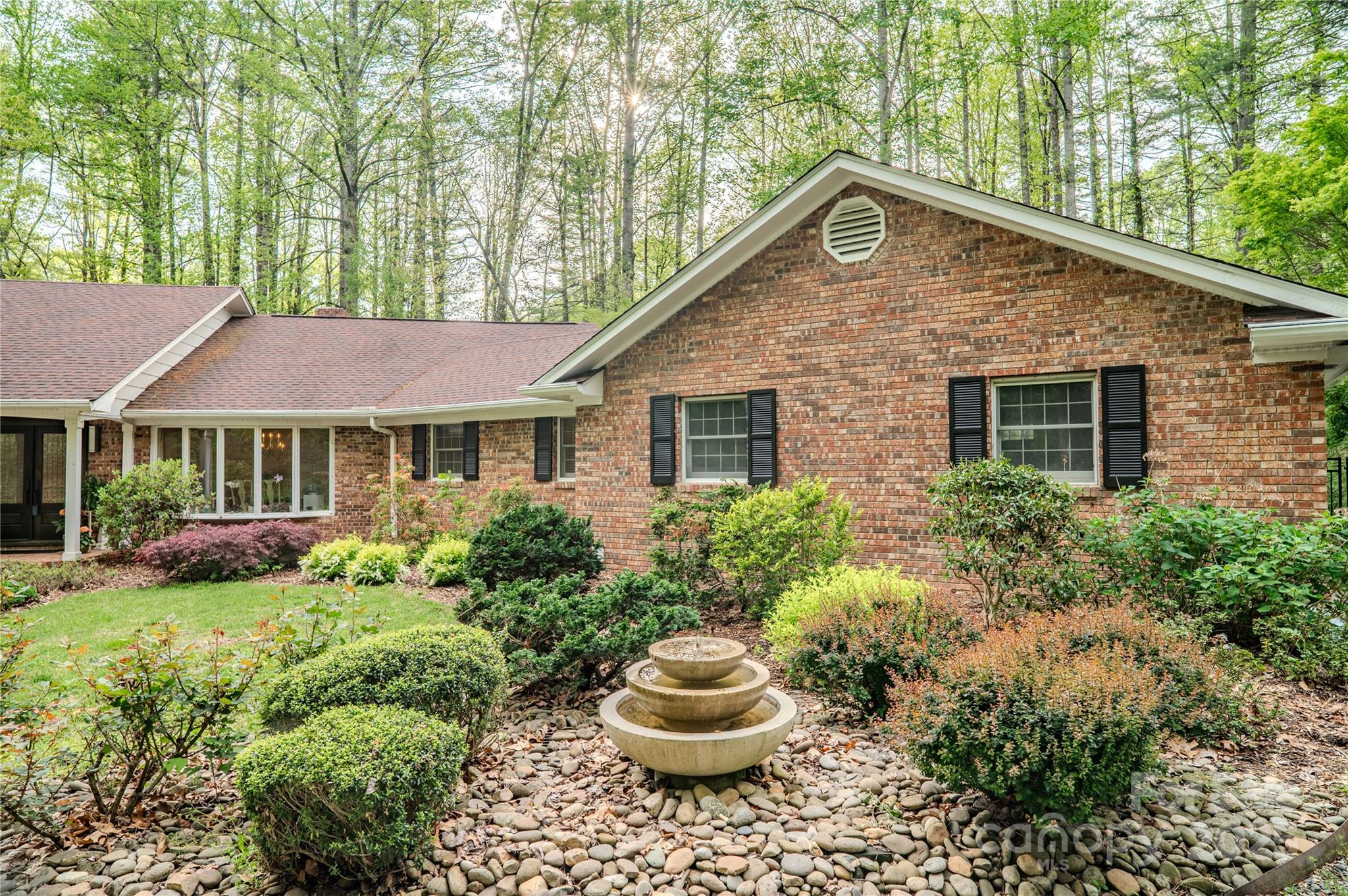 290 Tranquility Place Hendersonville, NC 28739 - Photo 3 of 48 a front view of house with yard and green space