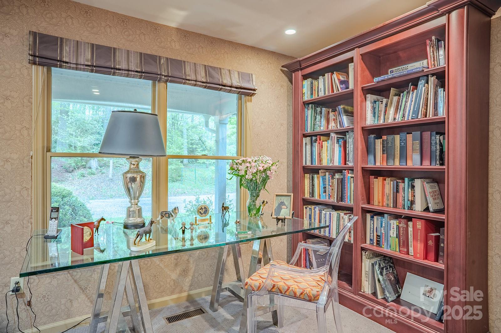 290 Tranquility Place Hendersonville, NC 28739 - Photo 34 of 48 a living room view with furniture and a book shelf