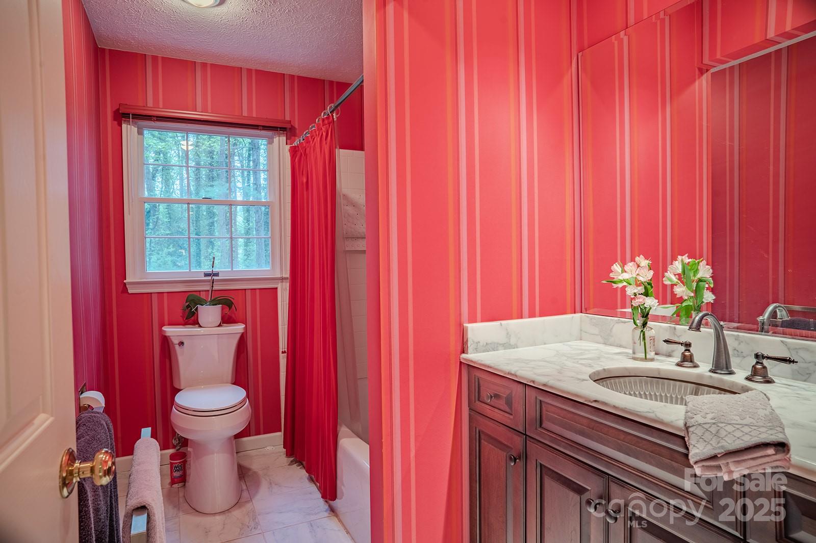 290 Tranquility Place Hendersonville, NC 28739 - Photo 36 of 48 a bathroom with a sink toilet and shower
