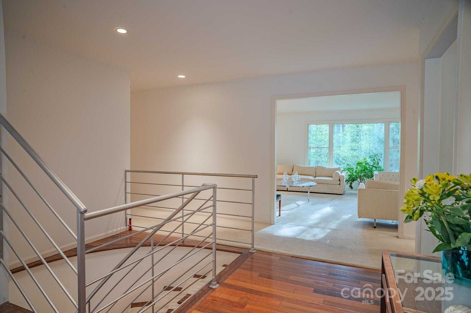 290 Tranquility Place Hendersonville, NC 28739 - Photo 9 of 48 a living room with furniture and a potted plant
