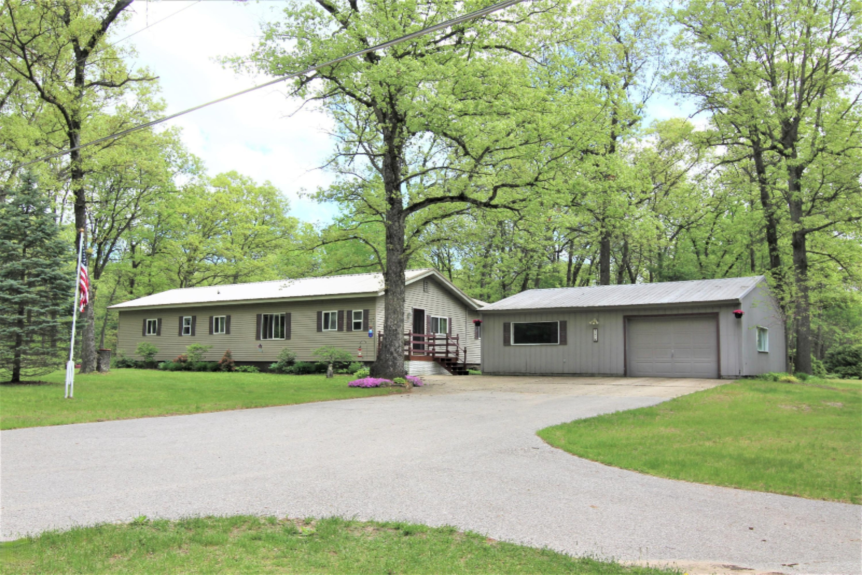 8738 Whitmire Road Holton, MI 49425 - Photo 1 of 29 Front