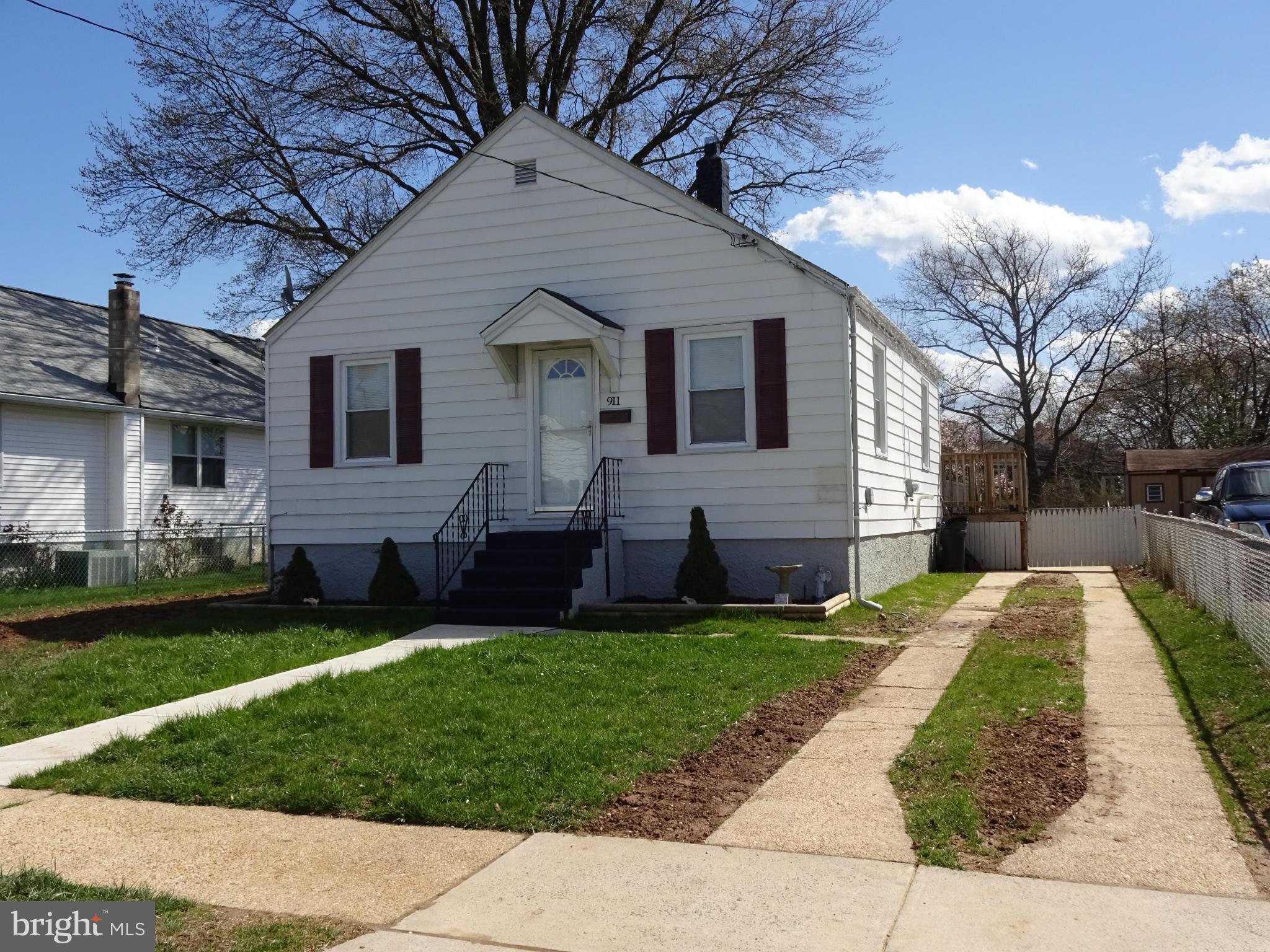 911 Woodlynn Road Baltimore, MD 21221 - Photo 2 of 10 a front view of a house with a garden