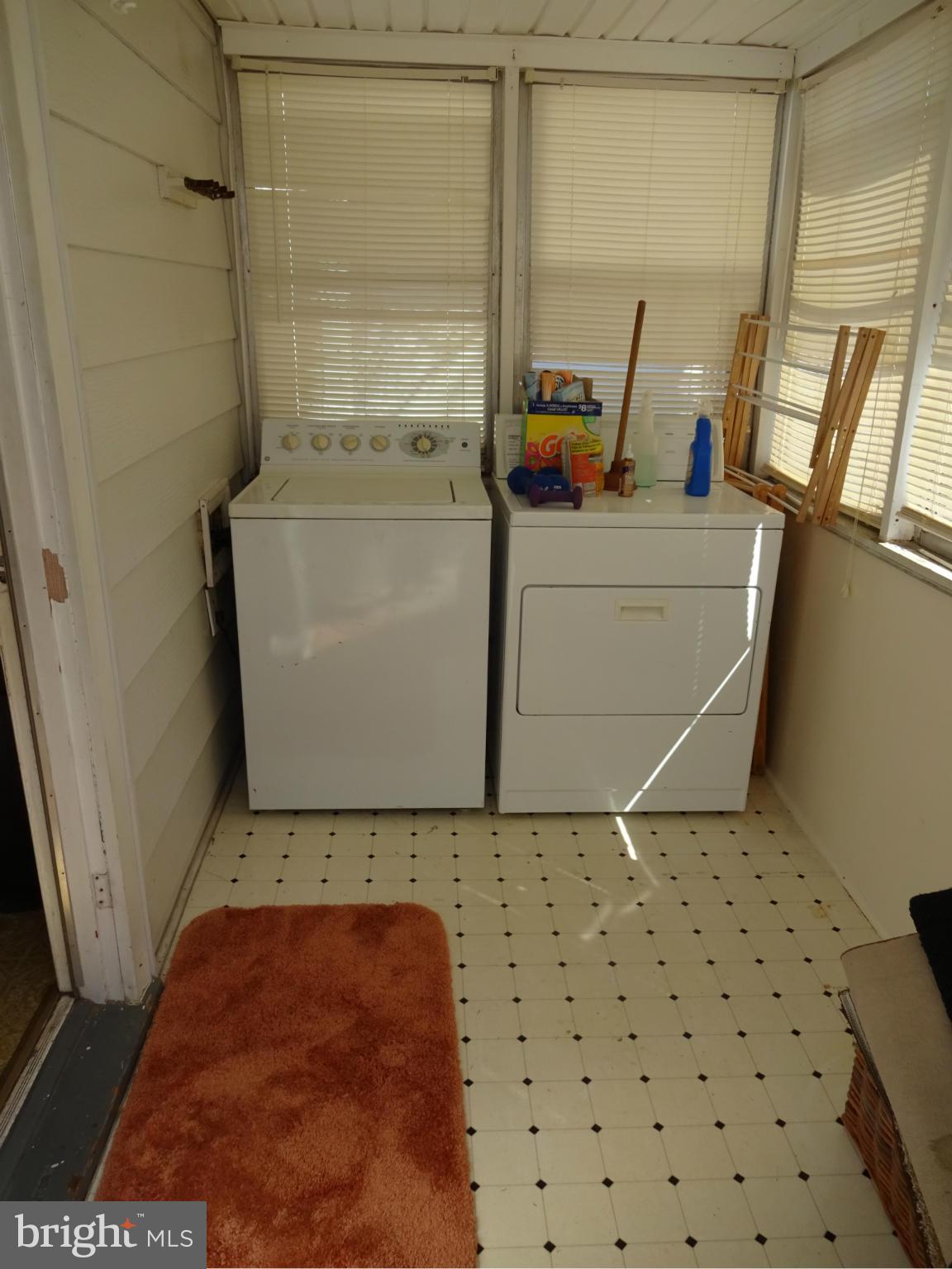 911 Woodlynn Road Baltimore, MD 21221 - Photo 6 of 10 a storage & utility room with a washer and dryer