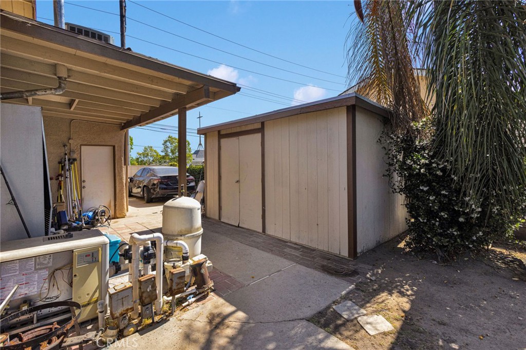 1087 Baseline Road La Verne, CA 91750 - Photo 36 of 39 a view of a patio with table and chairs and potted plants