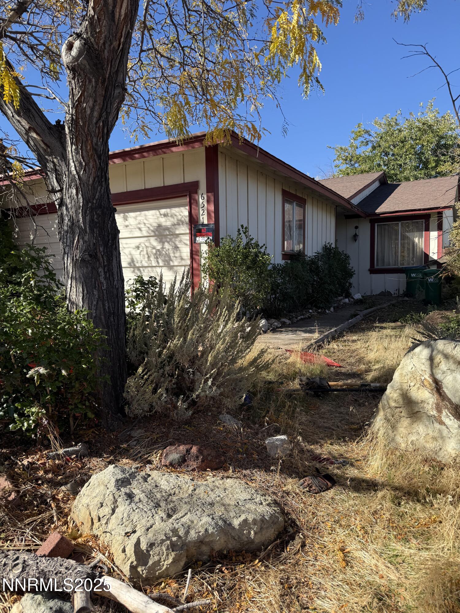 a view of a house with a yard covered with snow in the background