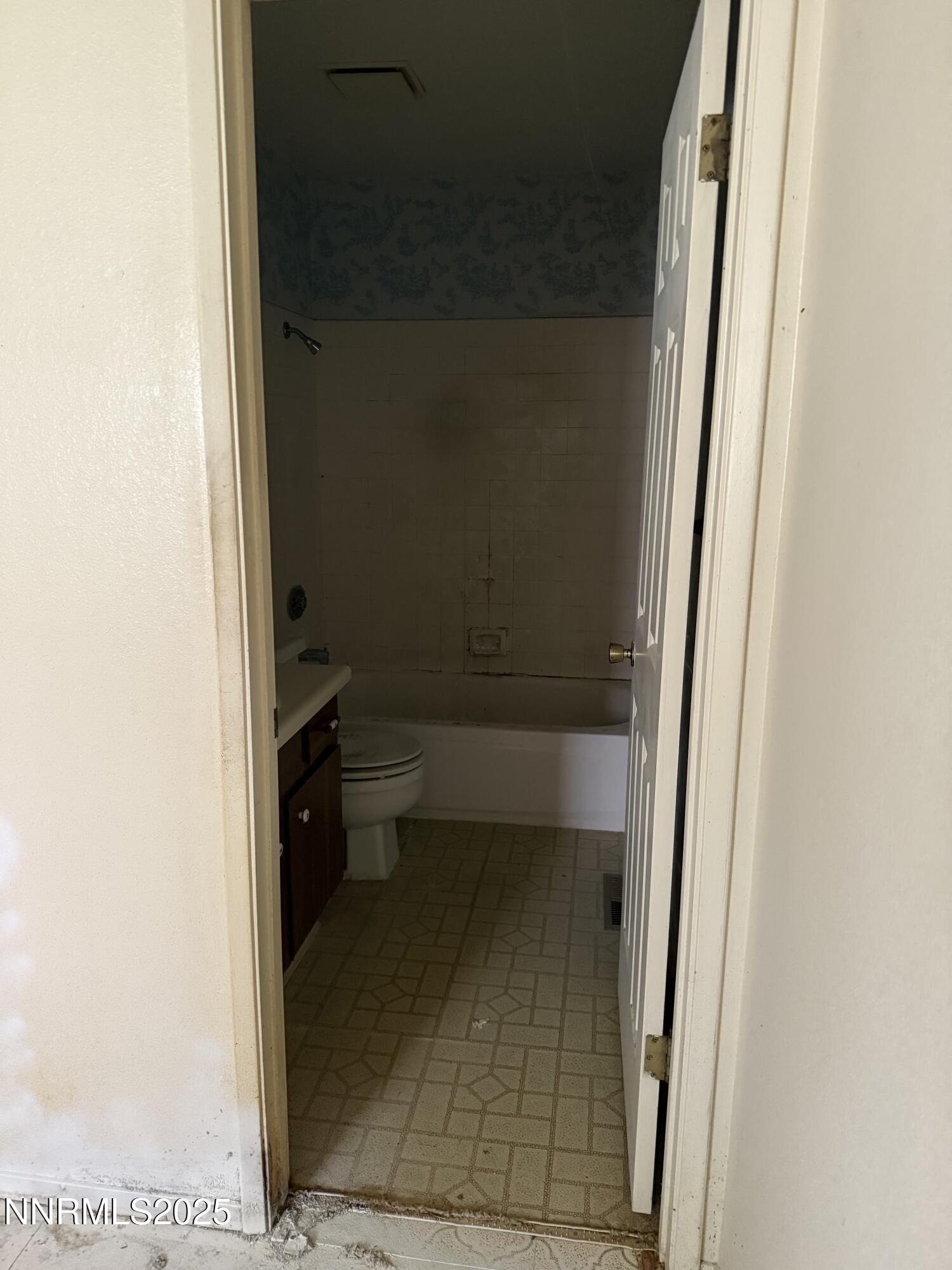 6521 Flower Street Reno, NV 89506 - Photo 6 of 9 a bathroom with a toilet