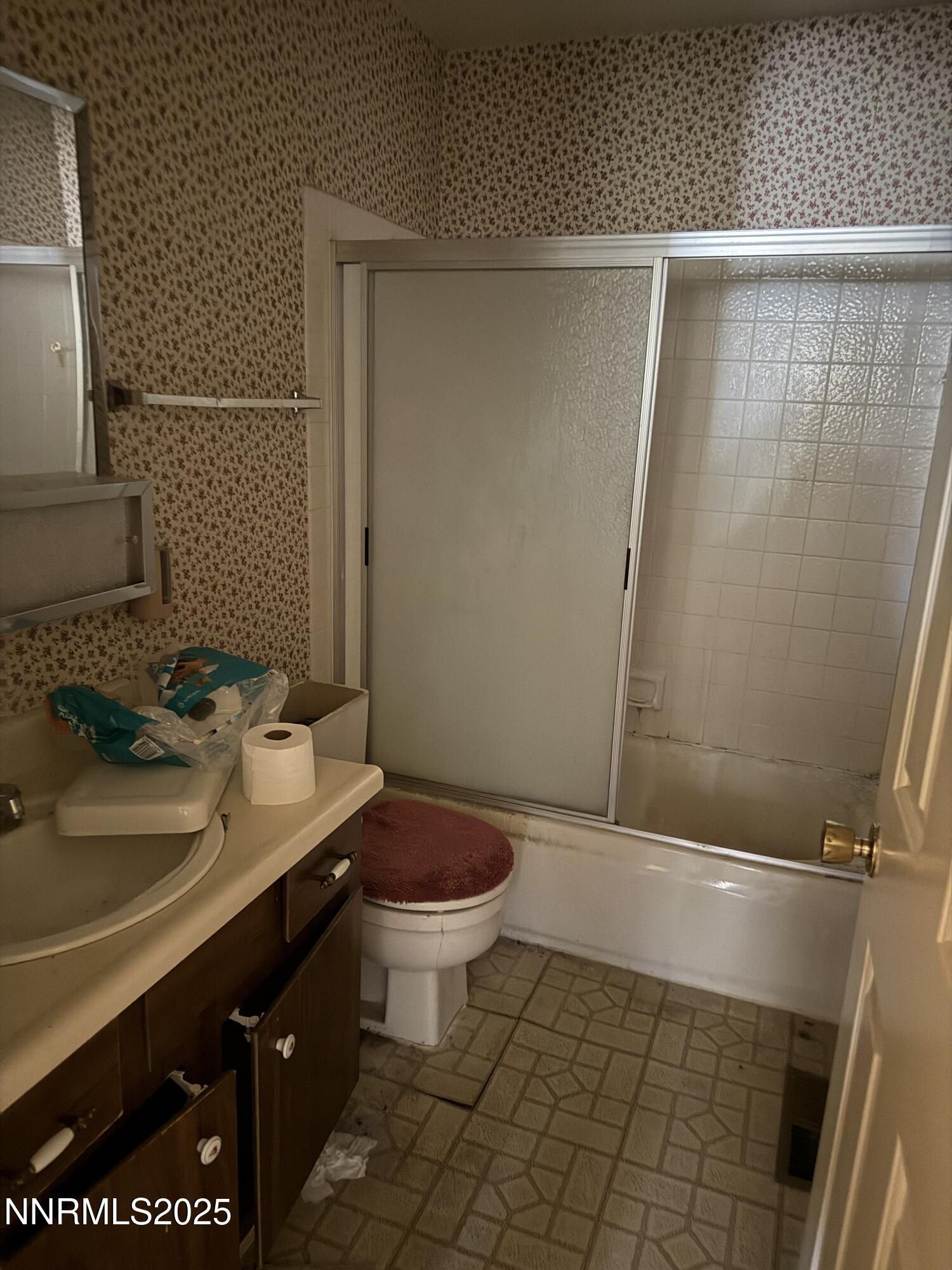 6521 Flower Street Reno, NV 89506 - Photo 9 of 9 a bathroom with a sink and a mirror