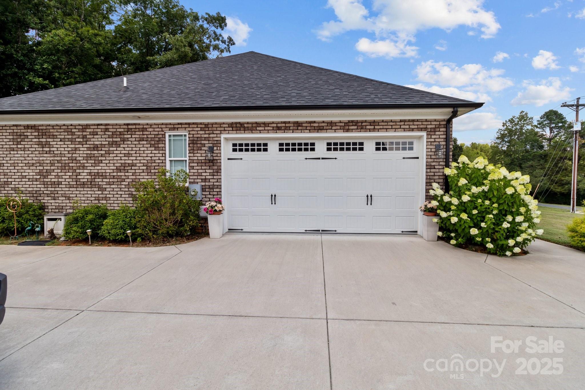 203 Poplins Grove Church Road Albemarle, NC 28001 - Photo 11 of 48 a view of a house with a garage