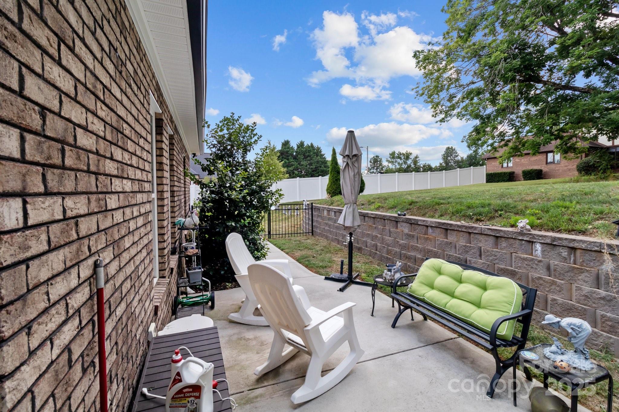203 Poplins Grove Church Road Albemarle, NC 28001 - Photo 12 of 48 a view of a chairs and table in the backyard