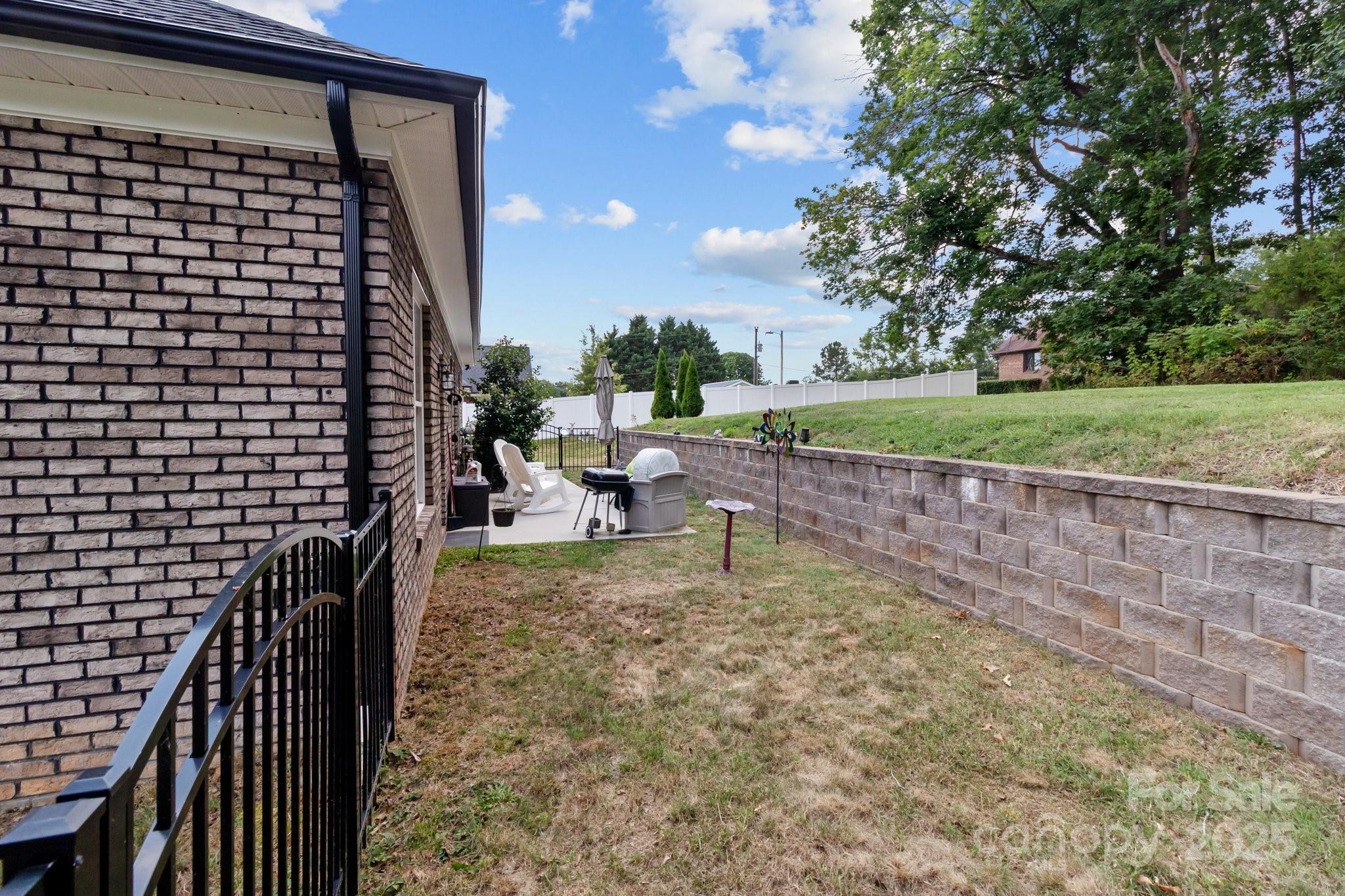 203 Poplins Grove Church Road Albemarle, NC 28001 - Photo 13 of 48 a view of a porch with a yard