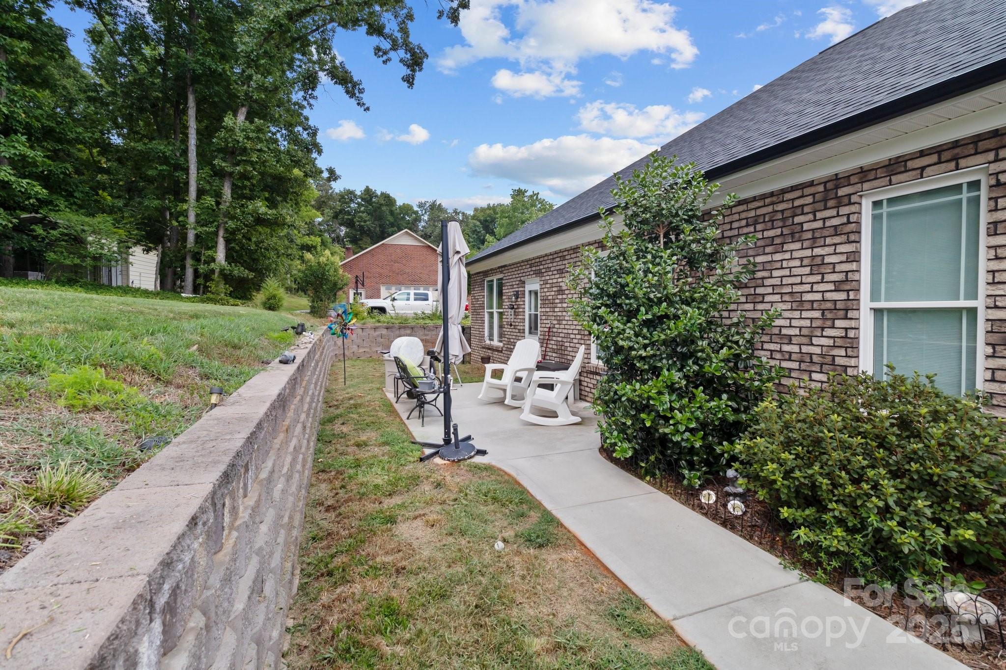 203 Poplins Grove Church Road Albemarle, NC 28001 - Photo 14 of 48 a view of a house with a yard