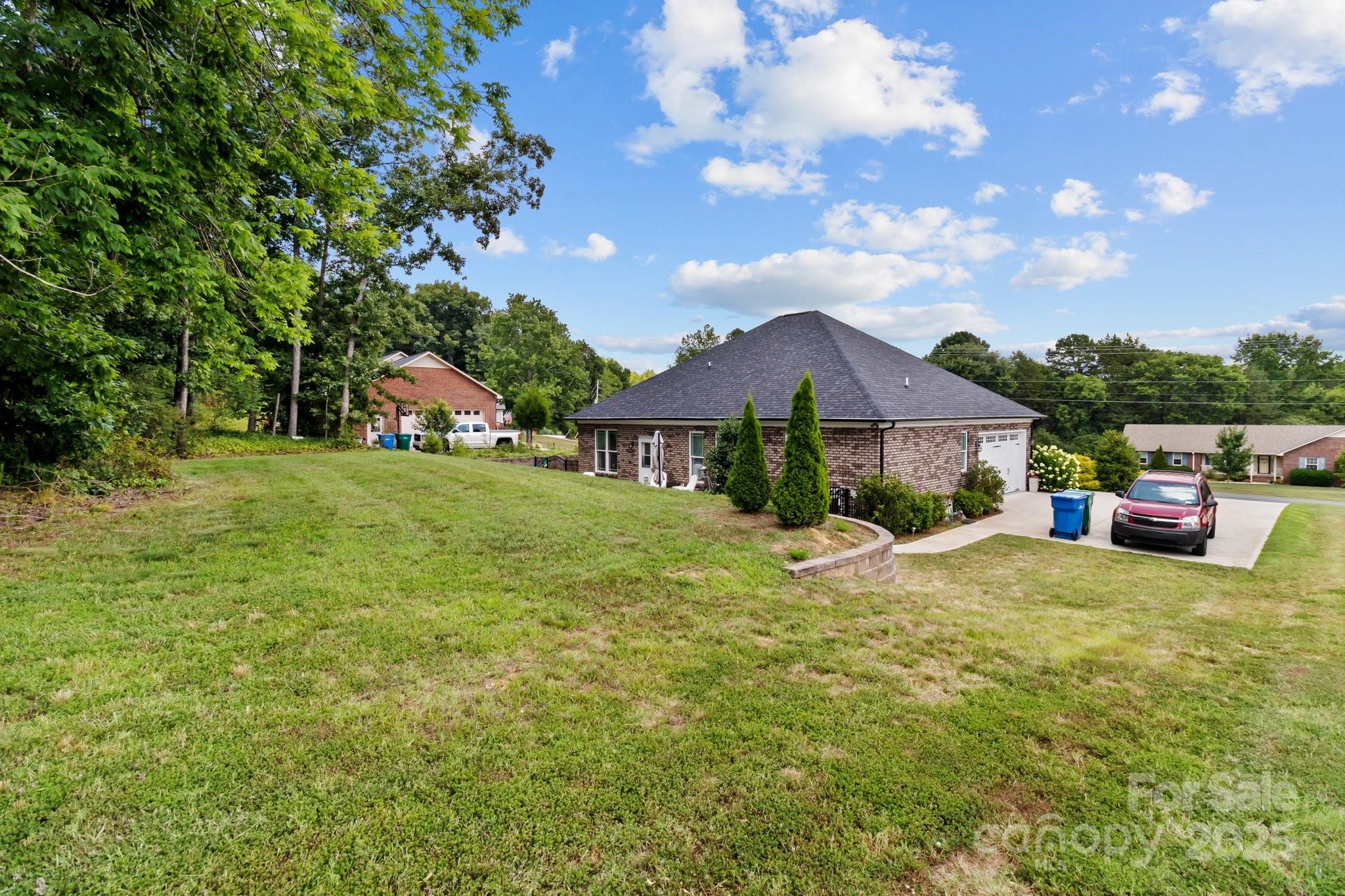 203 Poplins Grove Church Road Albemarle, NC 28001 - Photo 16 of 48 a front view of a house with a garden