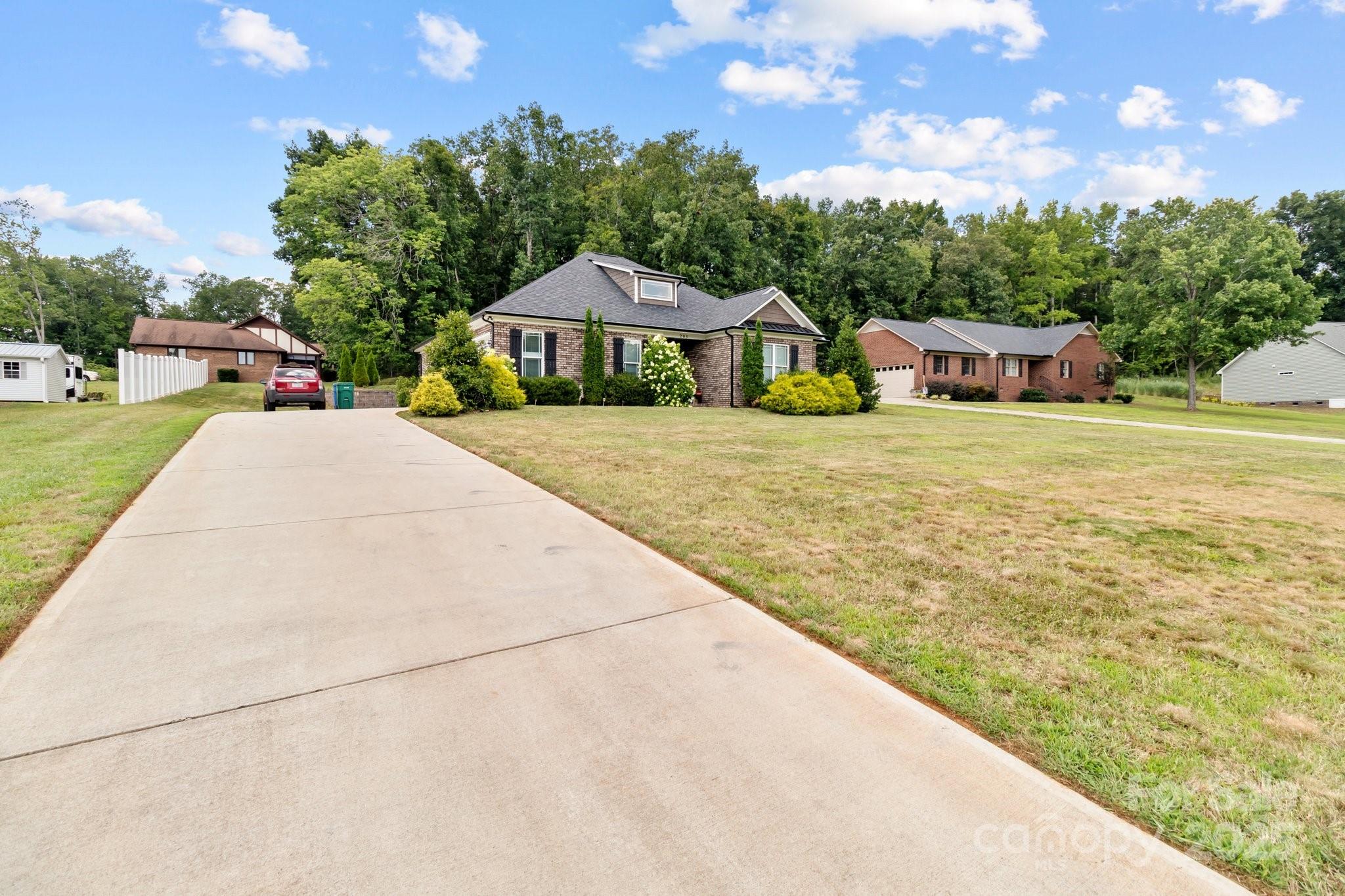 203 Poplins Grove Church Road Albemarle, NC 28001 - Photo 19 of 48 a front view of a house with yard