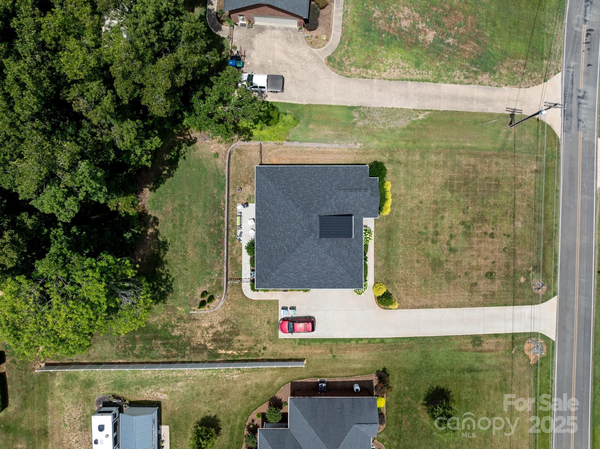 203 Poplins Grove Church Road Albemarle, NC 28001 - Photo 2 of 48 an aerial view of houses with yard