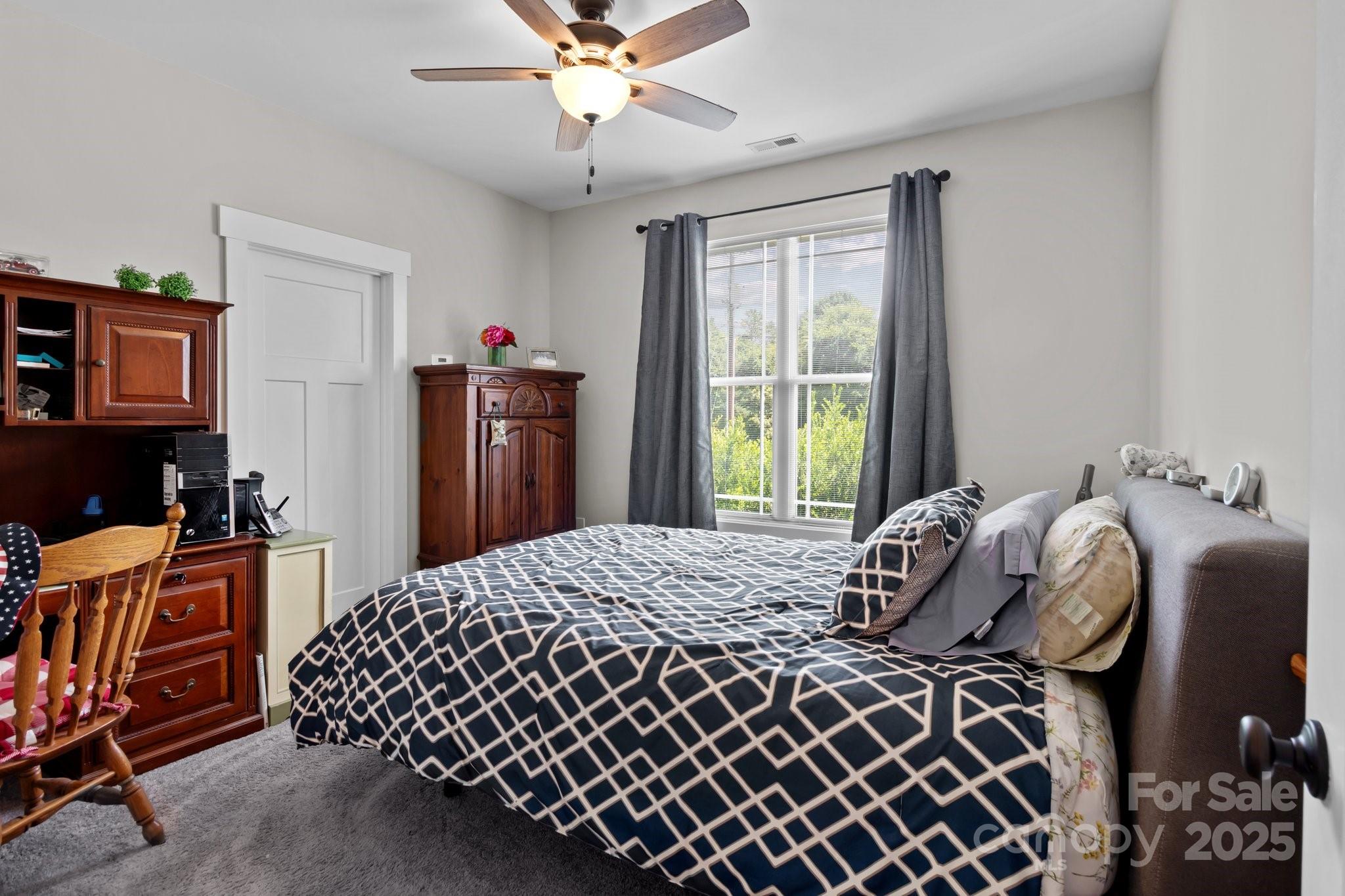 203 Poplins Grove Church Road Albemarle, NC 28001 - Photo 26 of 48 a bedroom with bed and wooden floor