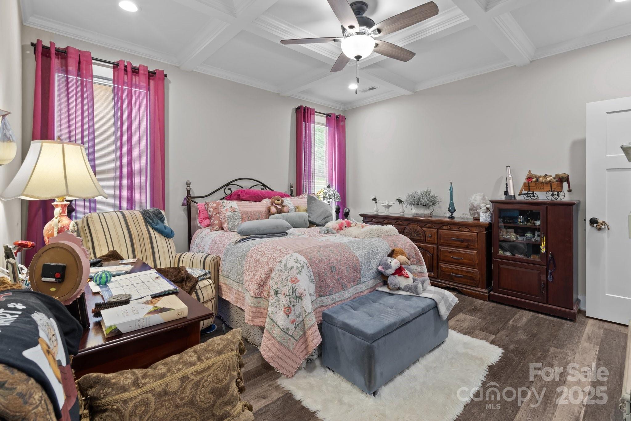 203 Poplins Grove Church Road Albemarle, NC 28001 - Photo 36 of 48 a bedroom with furniture and a chandelier