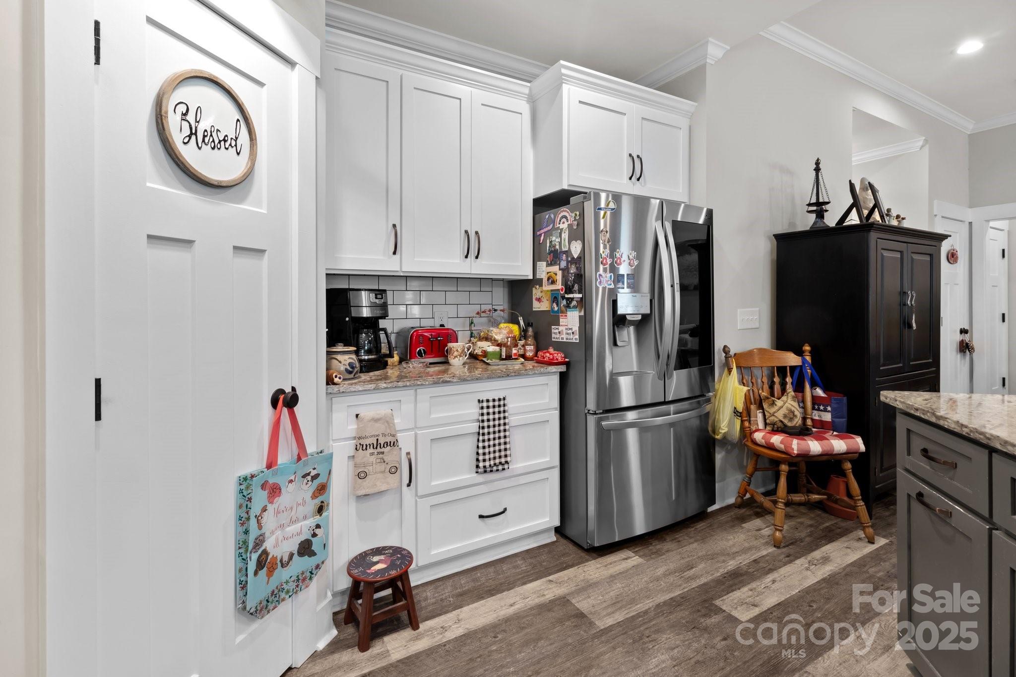 203 Poplins Grove Church Road Albemarle, NC 28001 - Photo 40 of 48 a kitchen with stainless steel appliances a refrigerator and a stove top oven