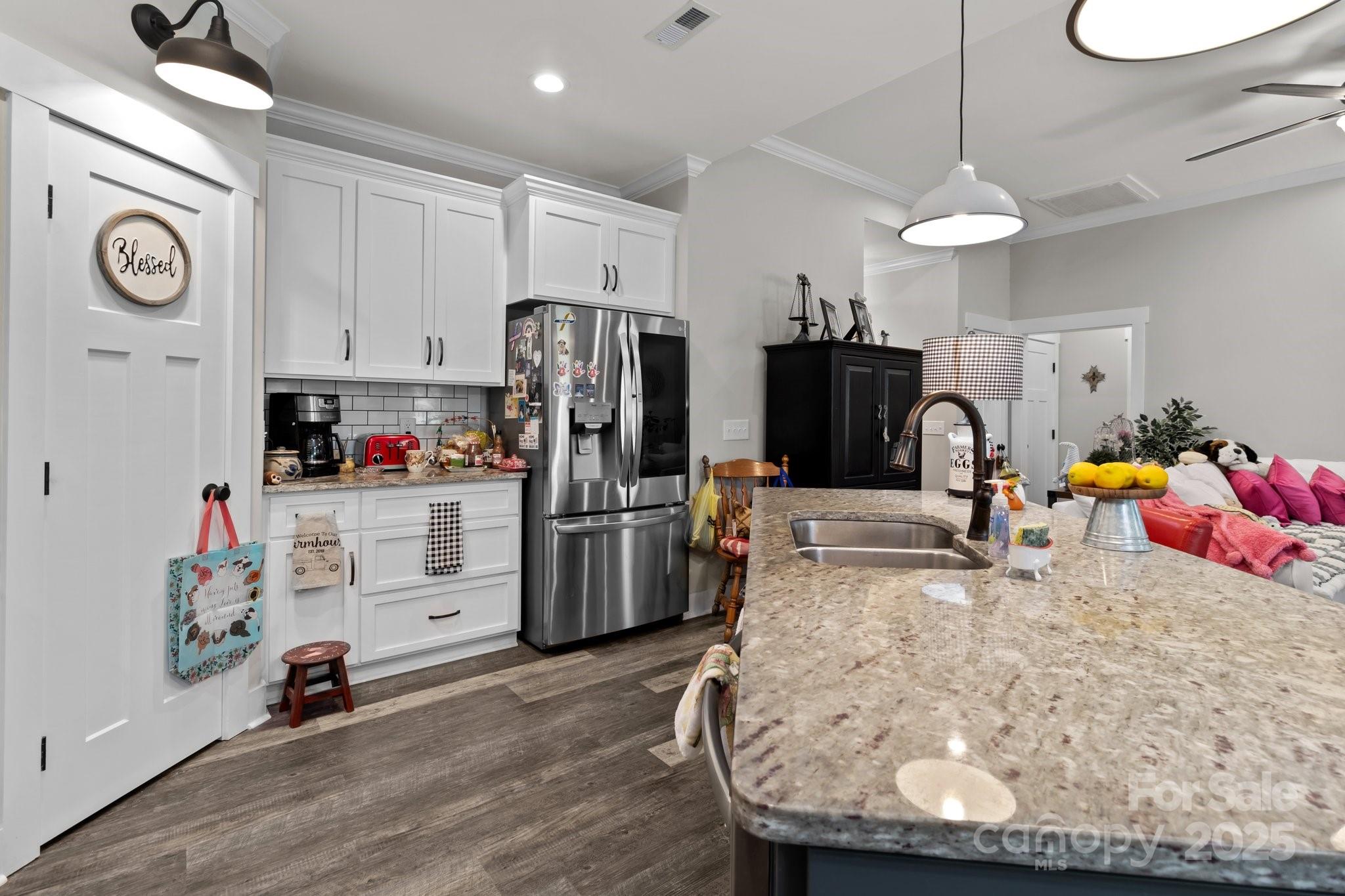 203 Poplins Grove Church Road Albemarle, NC 28001 - Photo 46 of 48 a kitchen with refrigerator and microwave