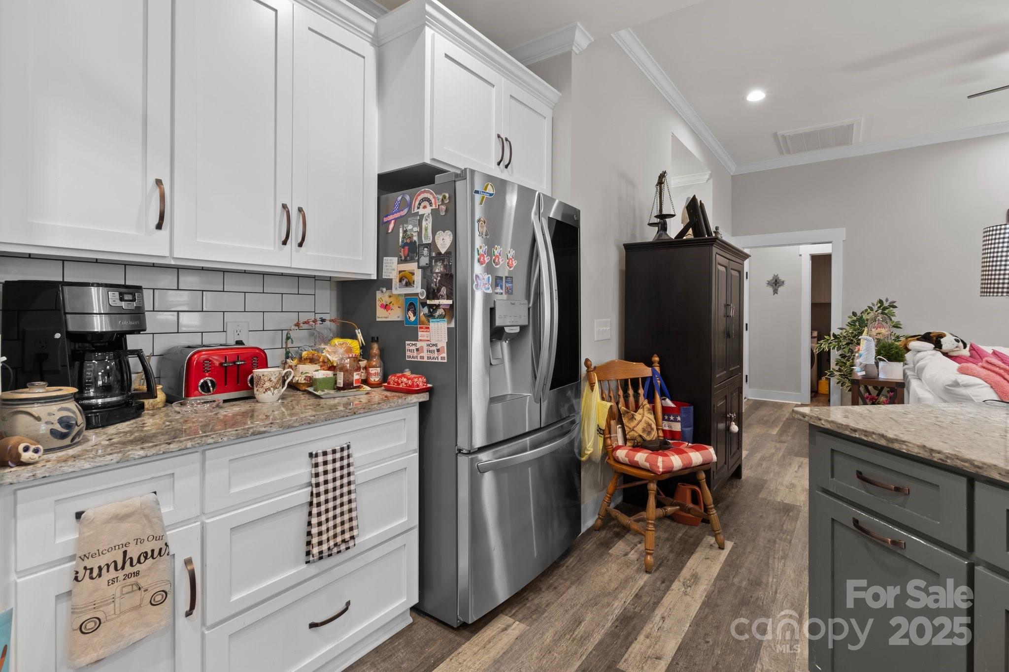 203 Poplins Grove Church Road Albemarle, NC 28001 - Photo 47 of 48 a kitchen with refrigerator a microwave a stove and cabinets