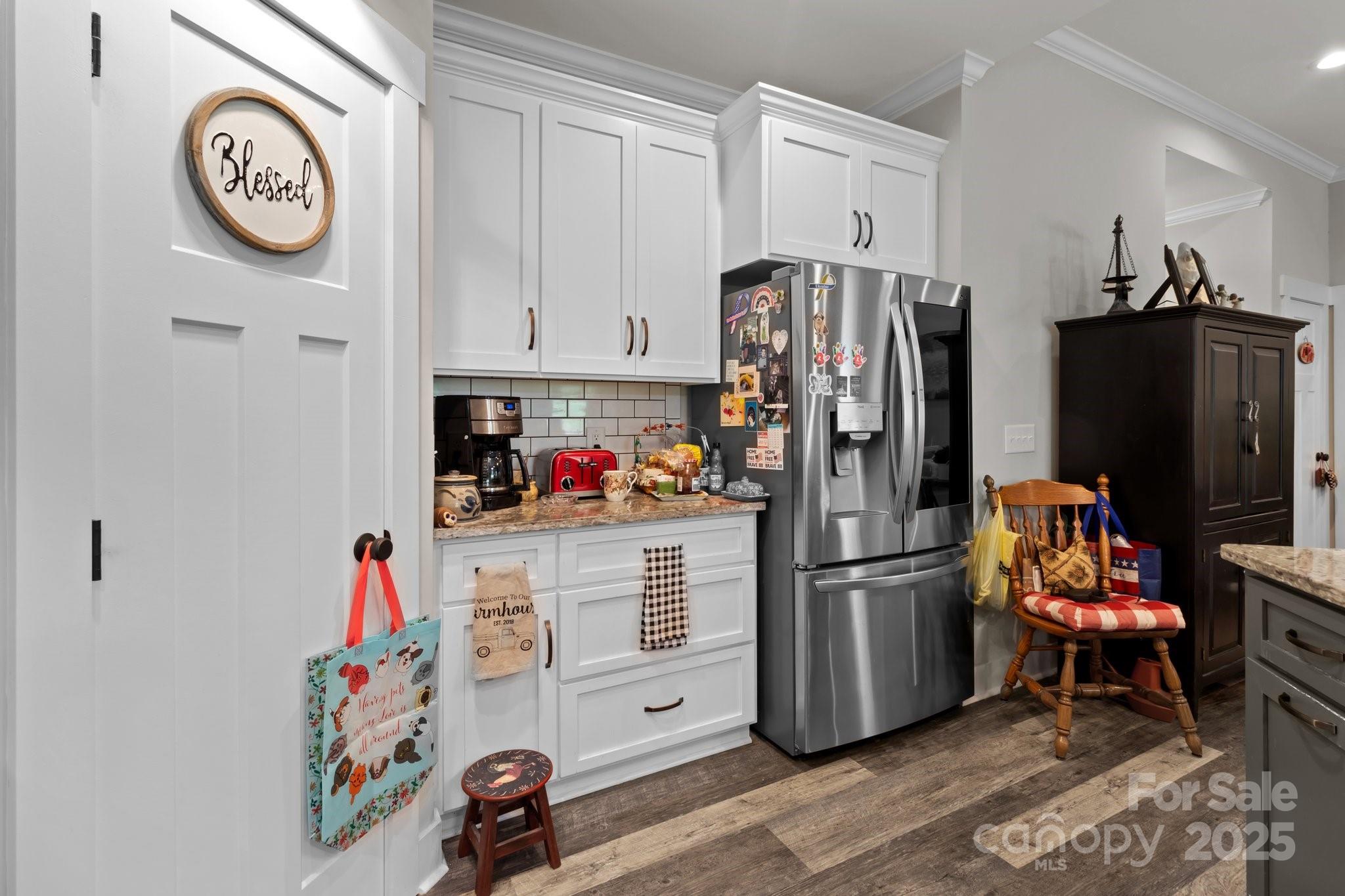 203 Poplins Grove Church Road Albemarle, NC 28001 - Photo 48 of 48 a kitchen with stainless steel appliances a refrigerator a stove a chimney and a refrigerator