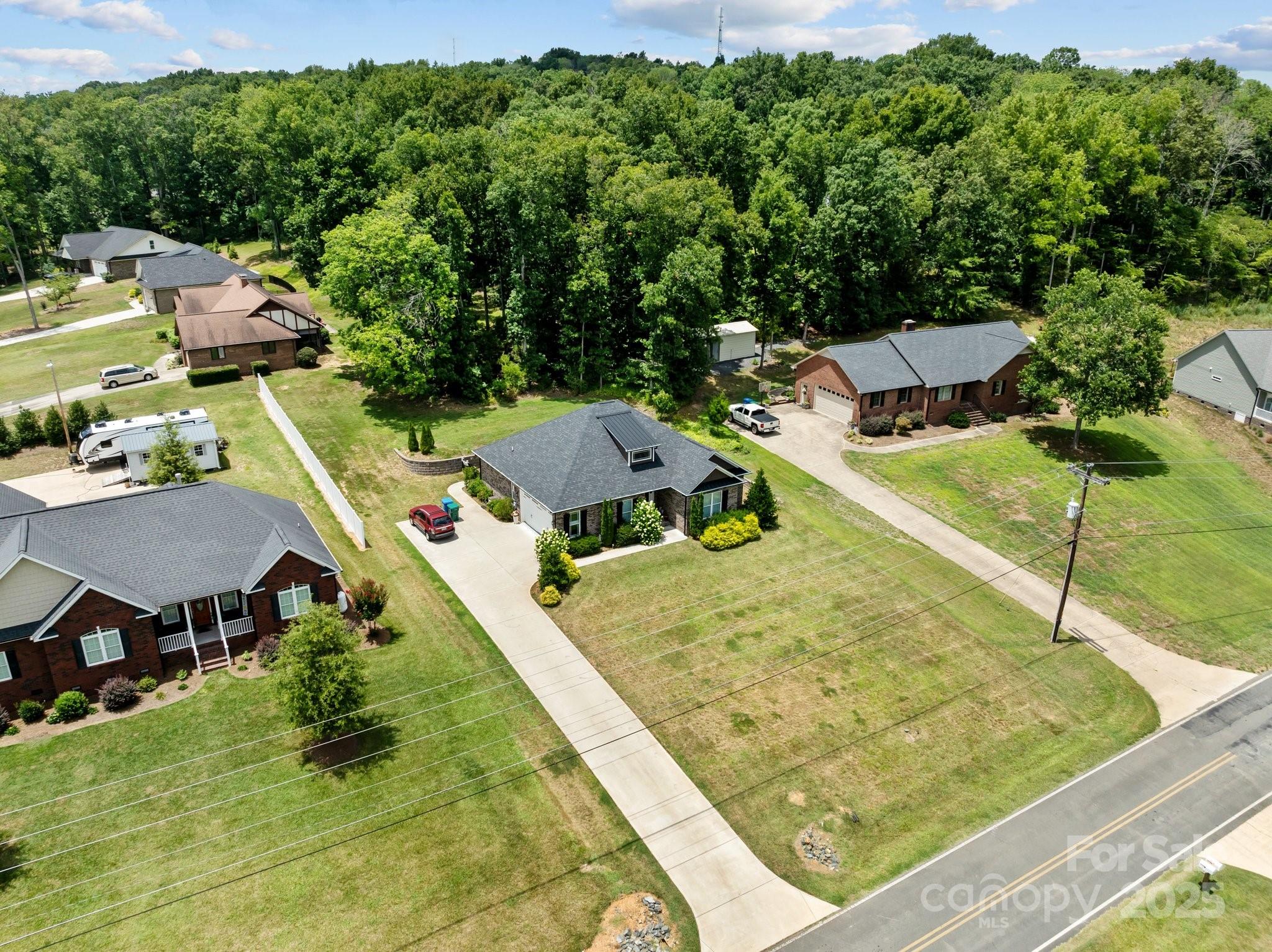 203 Poplins Grove Church Road Albemarle, NC 28001 - Photo 5 of 48 an aerial view of residential houses with outdoor space