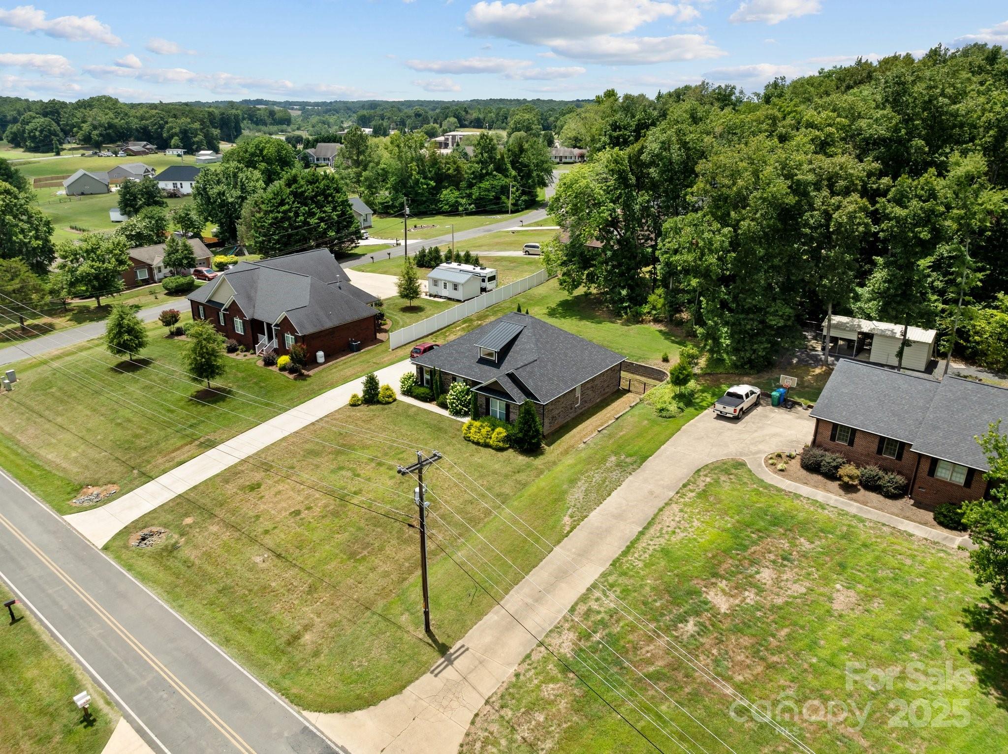 203 Poplins Grove Church Road Albemarle, NC 28001 - Photo 6 of 48 an aerial view of a pool