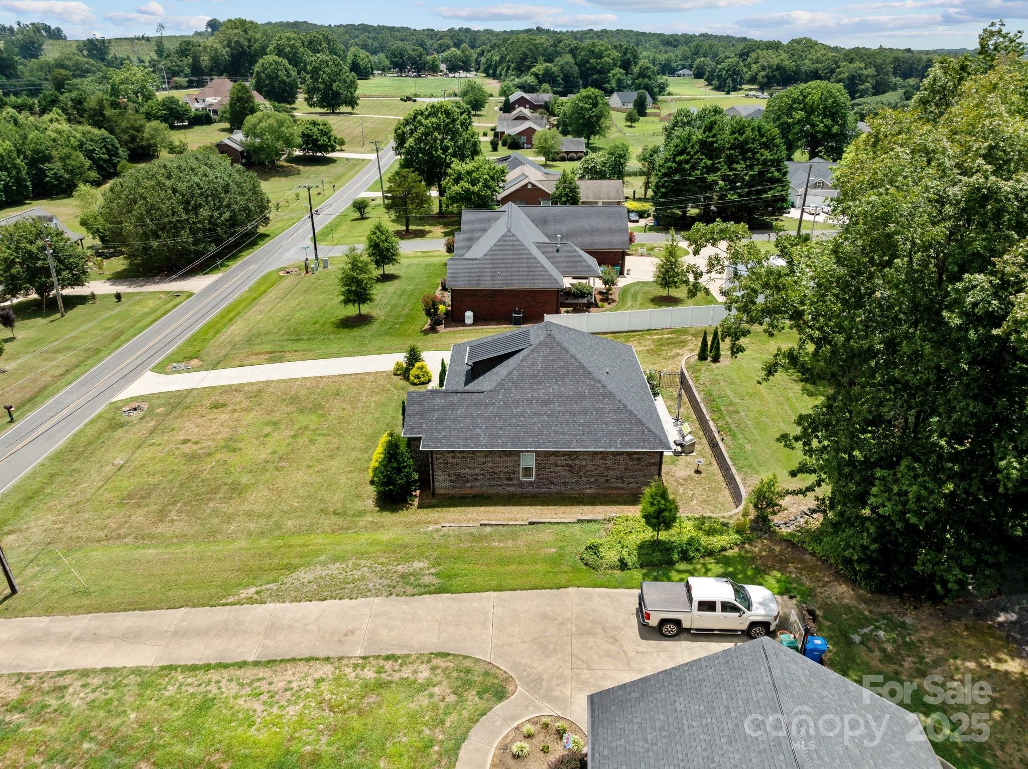 203 Poplins Grove Church Road Albemarle, NC 28001 - Photo 7 of 48 an aerial view of a house with a yard basket ball court and outdoor seating