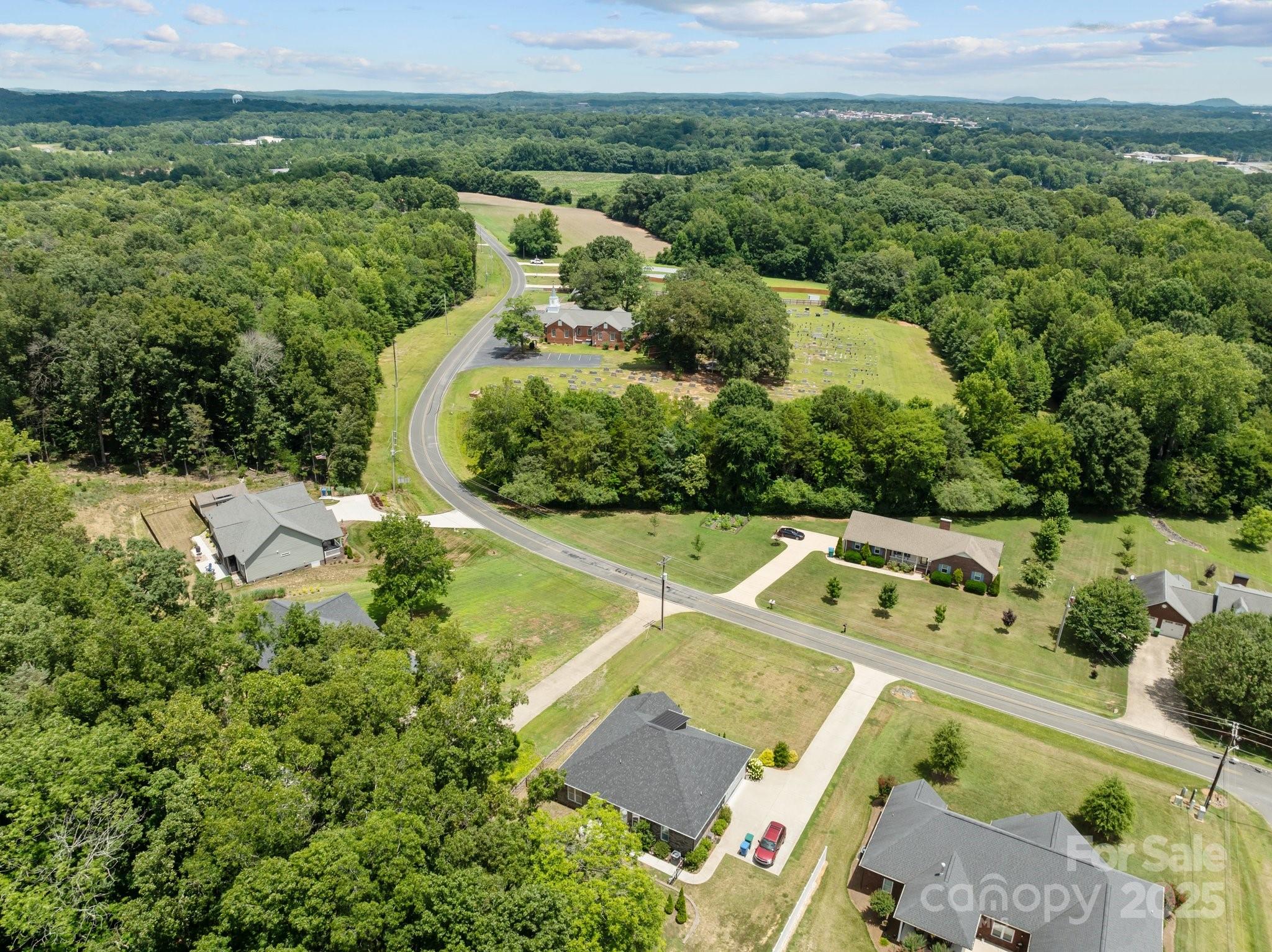203 Poplins Grove Church Road Albemarle, NC 28001 - Photo 8 of 48 an aerial view of a house with a garden