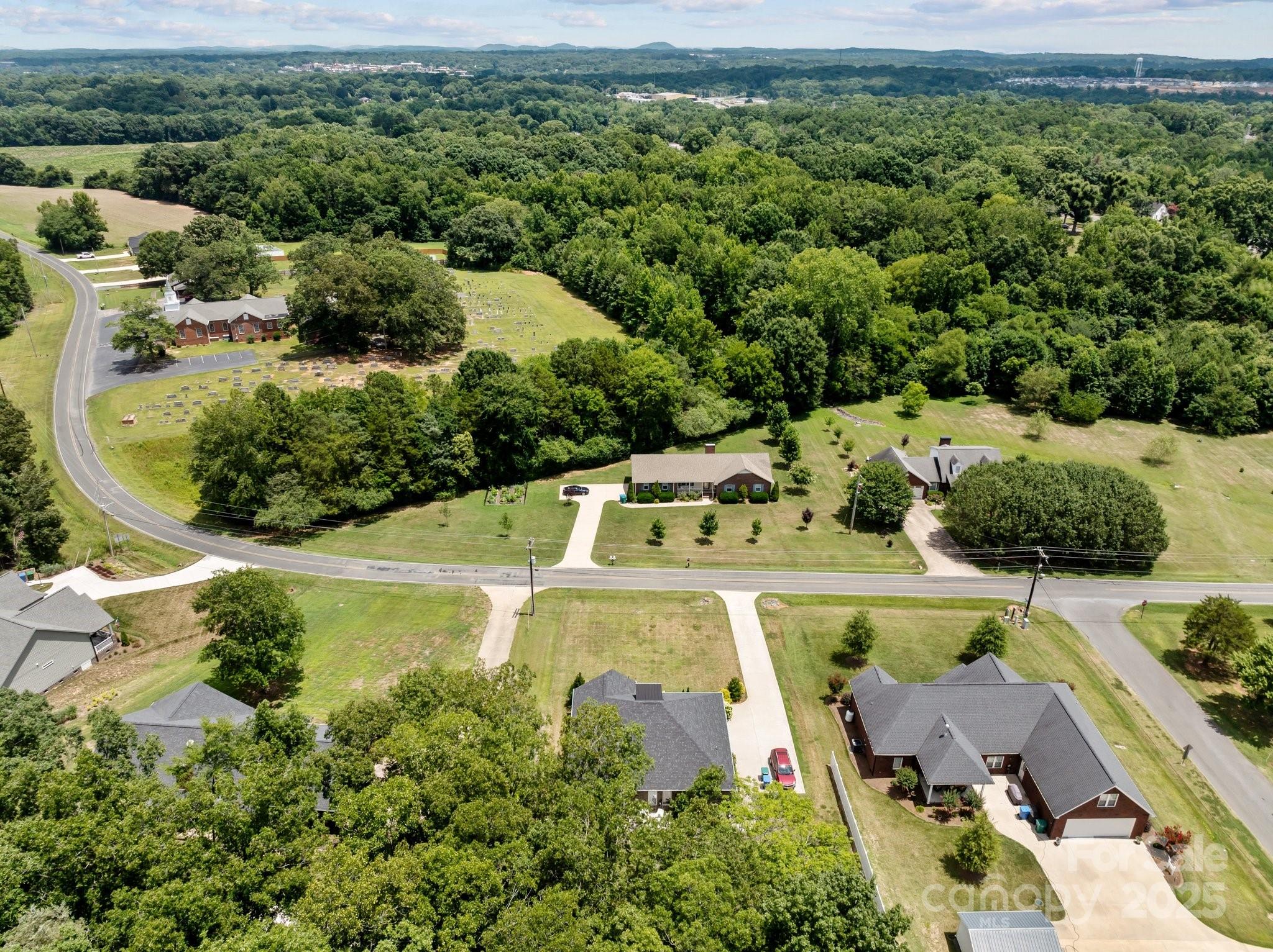 203 Poplins Grove Church Road Albemarle, NC 28001 - Photo 9 of 48 an aerial view of a house with a garden