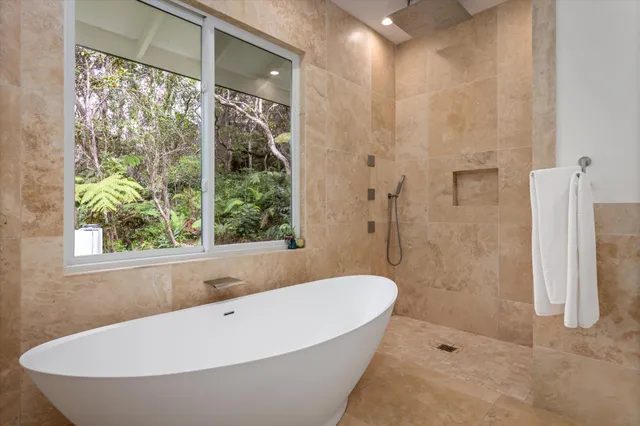 a bathroom with a bathtub and shower