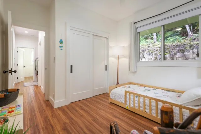 a bedroom with furniture and a window