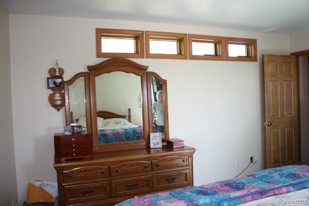 5067 Mason Road Howell, MI 48843 - Photo 15 of 43 bdrm 3 has door to deck overlooking backyard