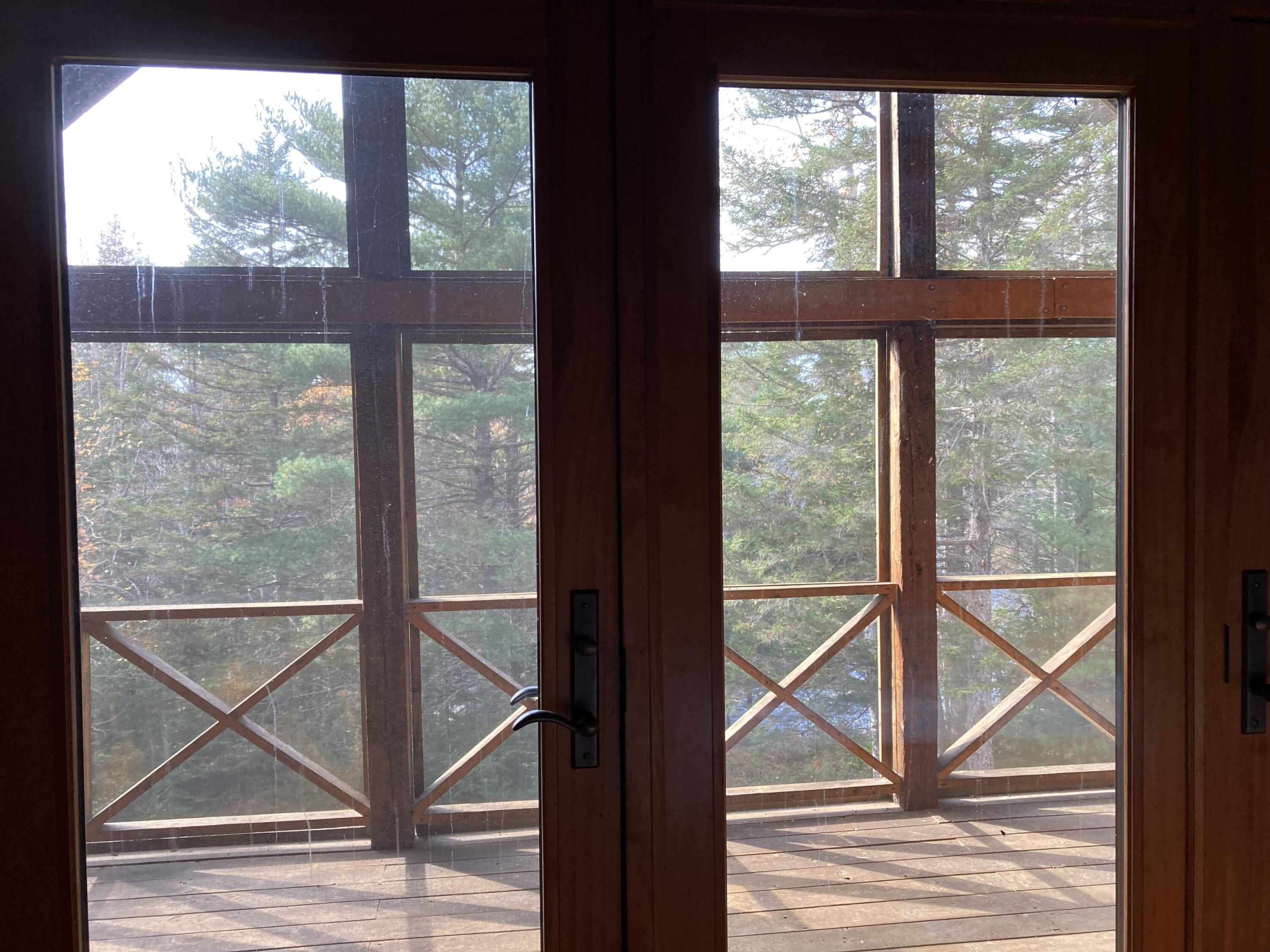 414 River Bend Cherryfield, ME 04622 - Photo 15 of 38 Screened porch from primary BR.