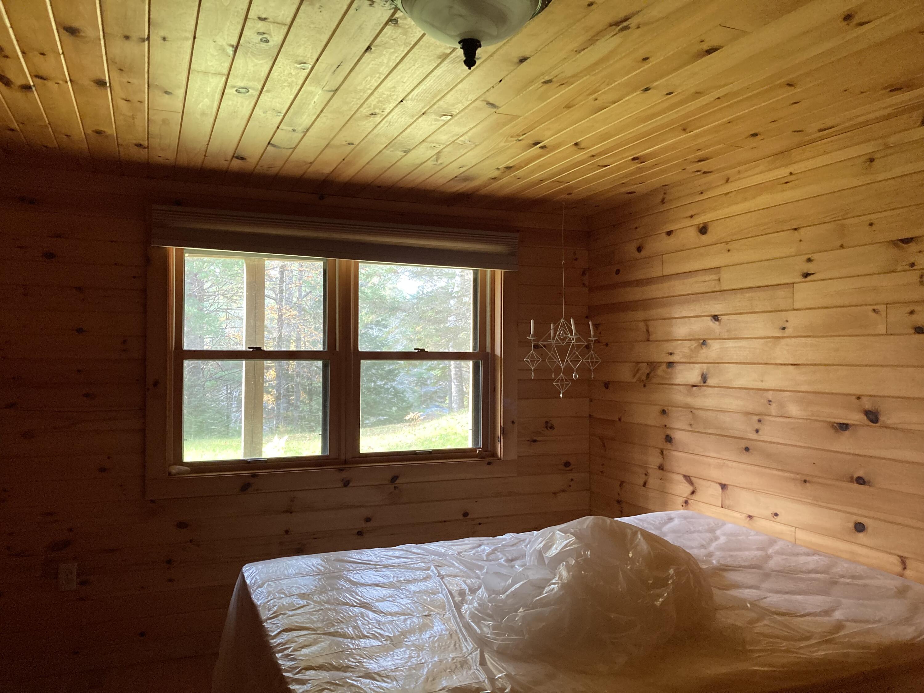 414 River Bend Cherryfield, ME 04622 - Photo 17 of 38 Lower level bedroom w/views of river.