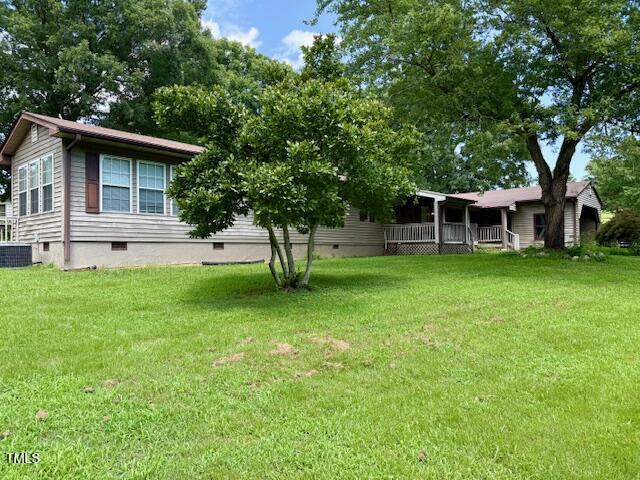 4254 Bowmantown Road Roxboro, NC 27574 - Photo 2 of 23 a view of a house with a backyard
